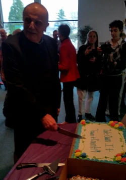 Photo of celebratory cake-cutting at Town & Country Estates.