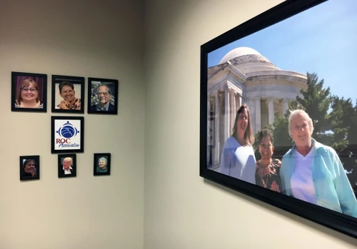 Photo of the ROC USA conference room with photos of the current and past ROC Association Directors as well as a large photo of the first elected Directors.