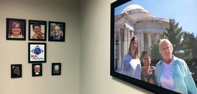 Photo of the ROC USA conference room with photos of the current and past ROC Association Directors as well as a large photo of the first elected Directors.