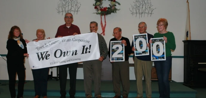 Photo of ROC leaders holding a We Own It banner