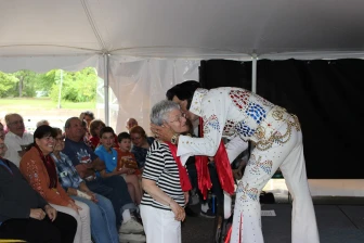 Photo of singer kissing audience member during