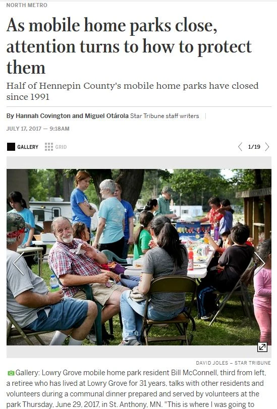 Screen shot of article with accompanying photo showing people forced to leave their community having a celebration in the weeks before the community closed.