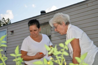 Photo of Natividad Seefeld and a neighbor at Park Plaza Coperative.