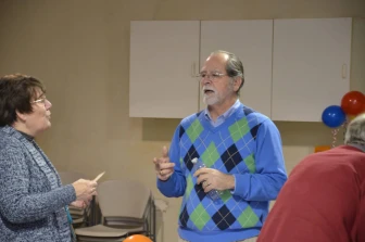 Photo of Kim Capen speaking to co-op residents.