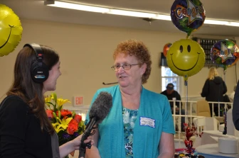 Photo of Halifax Estates Board President Nancy Froio being interviewed by a radio reporter.