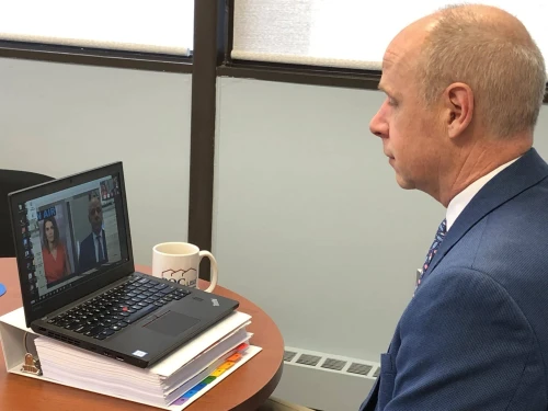 Paul Bradley being interviewed through his laptop.